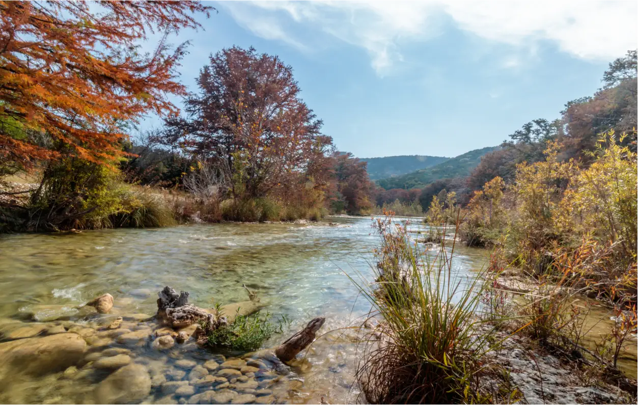 Frio Canon The Canyon 6 A clear stream running through the fall foliage in a state park.